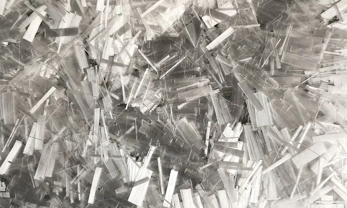 Close-up of densely packed shredded white paper strips, illustrating a paper-based substrate option.